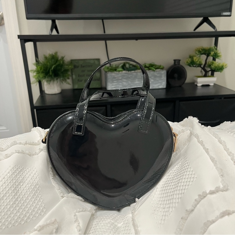 Black heart shaped purse.